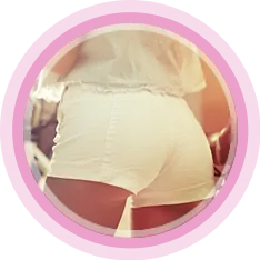 Woman wearing white shorts and white blouse