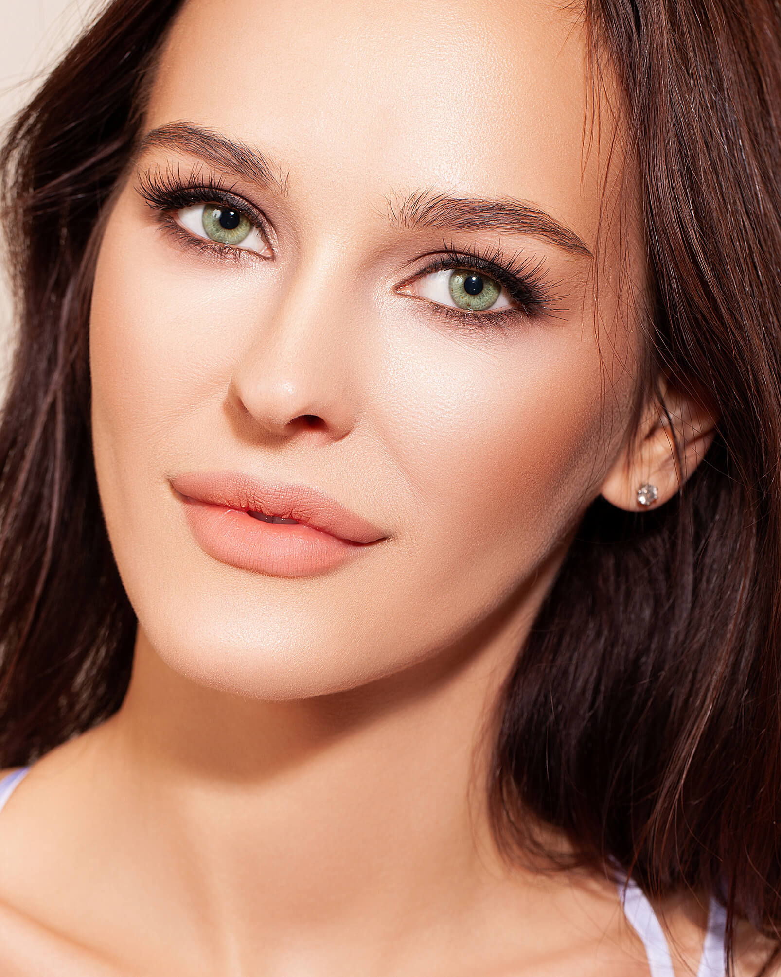 Beautiful brunette woman with green eyes