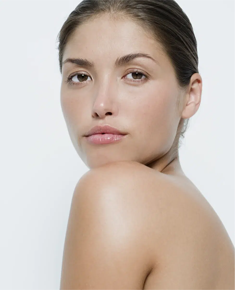 Brunette woman looking over her shoulder